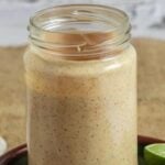 A pin for pinterest graphic with image of Greek yogurt chipotle sauce and text on top.