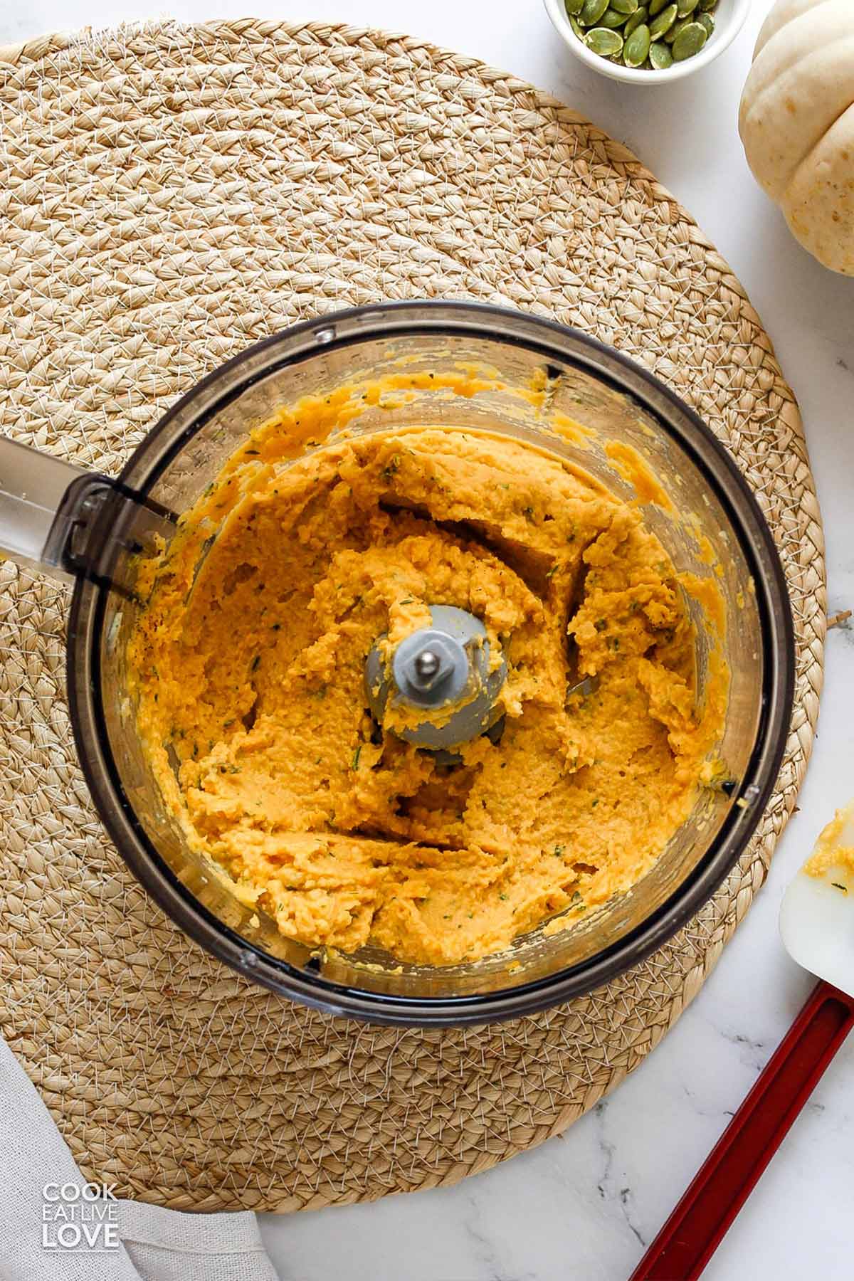 Blended savory dip in a food processor.