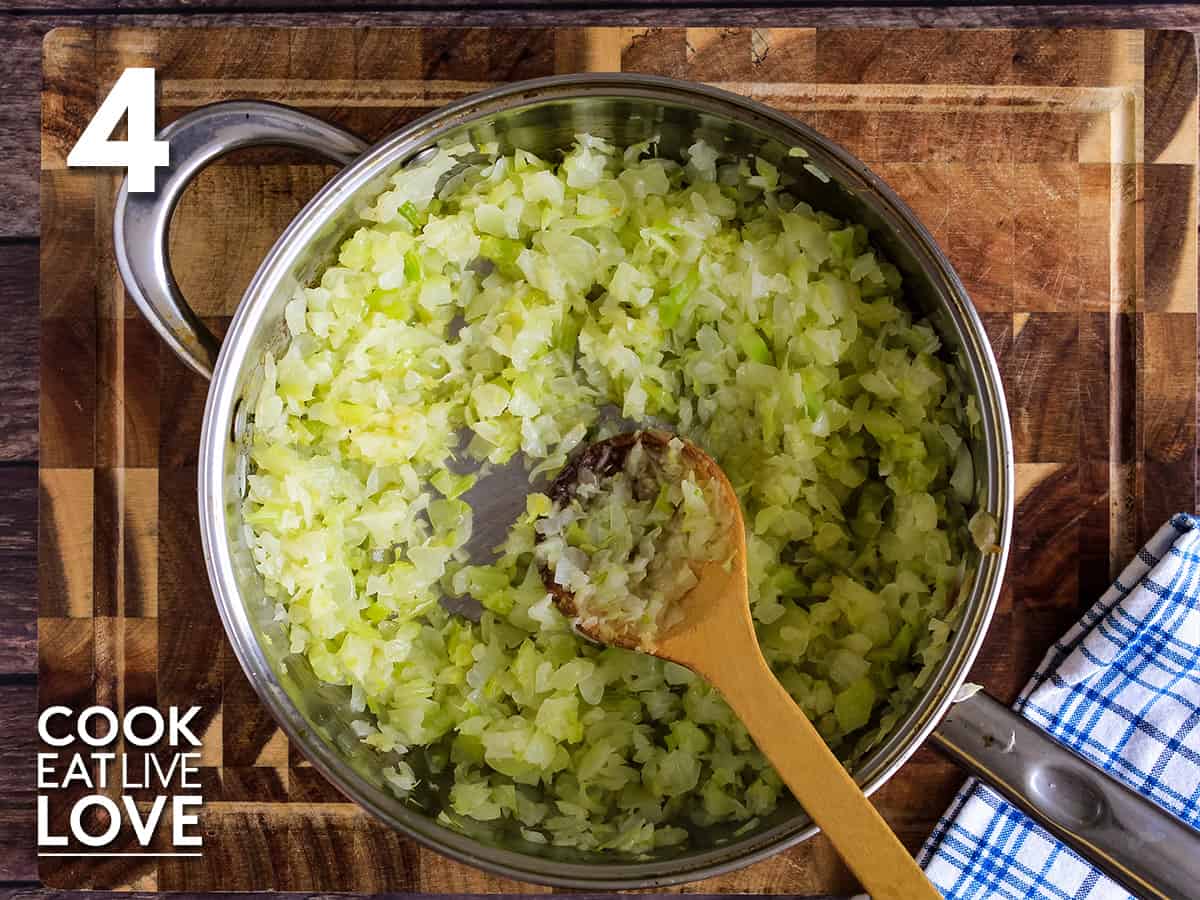 Chopped onions and celery in saute pan cooked and ready to make gluten free cornbread stuffing.