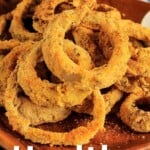 Pin for pinterest graphic with image of vegan onion rings and text on top.