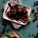 Brownies on plates with chocolate drizzle