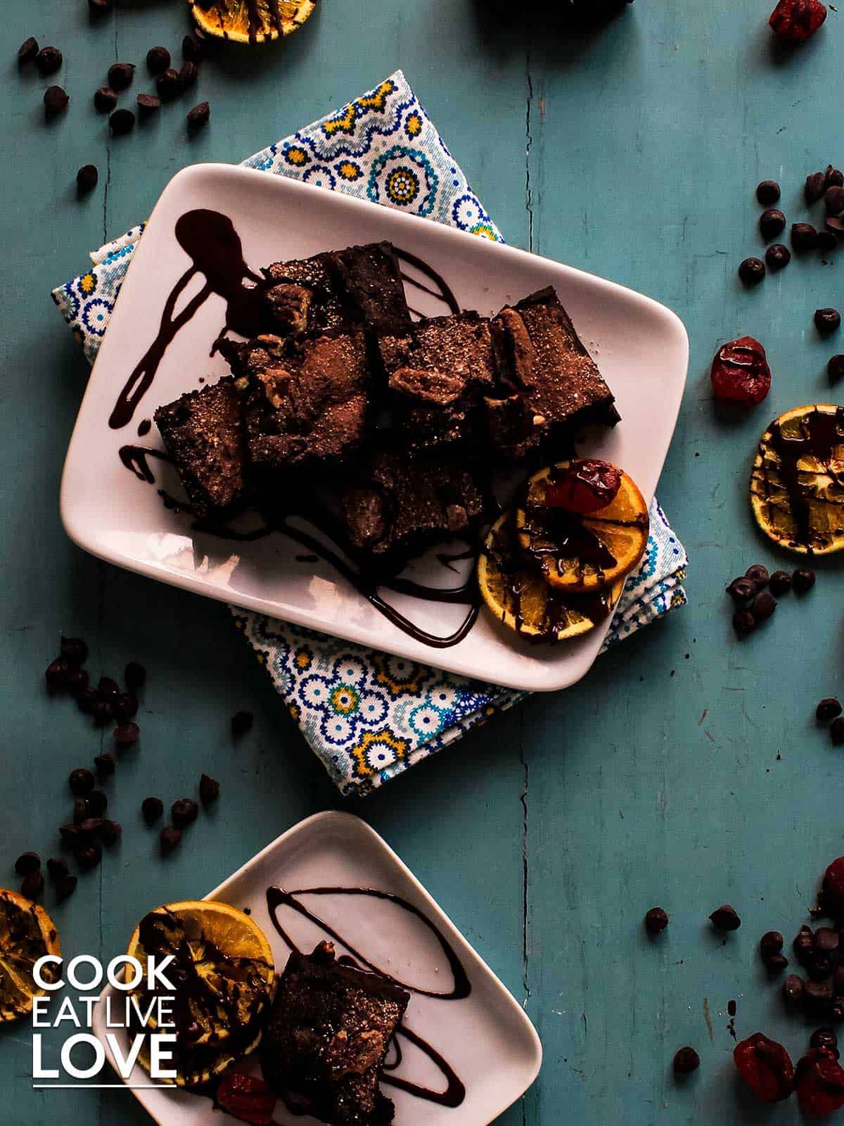 Brownies on plates with chocolate drizzle