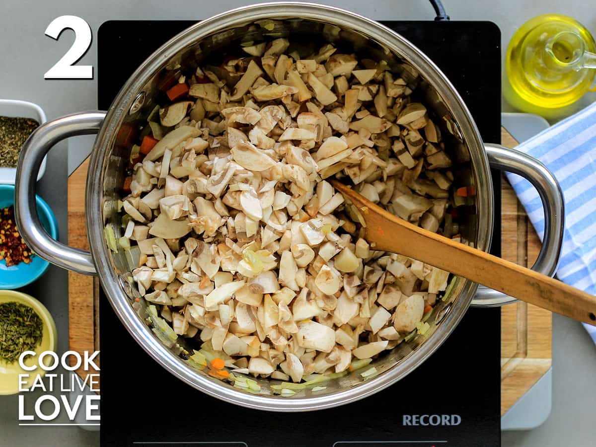 Mushrooms added to skillet on burner