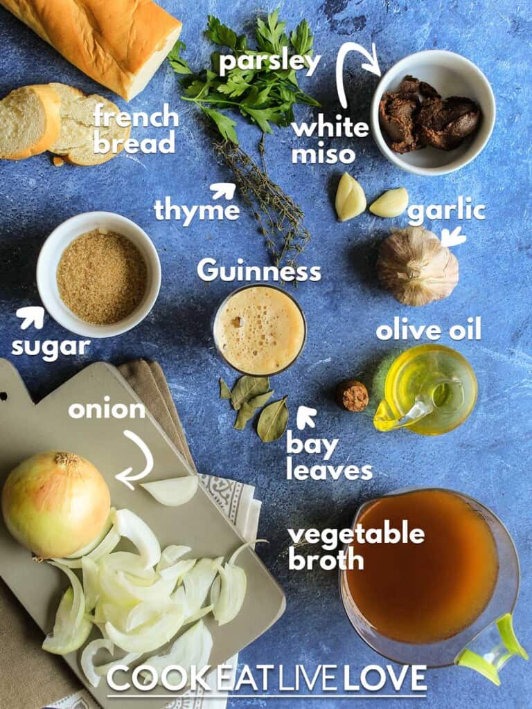 Ingredients to make vegan french onion soup on table with text labels
