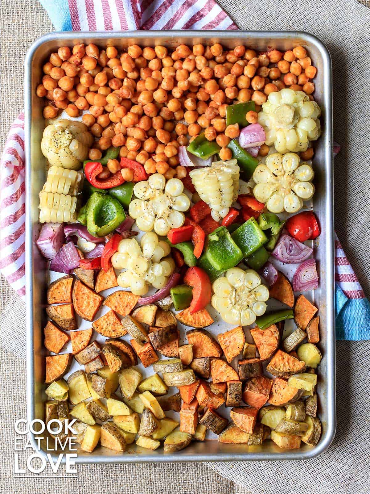 BBQ chickpeas and veggies cooked and ready on the sheet pan