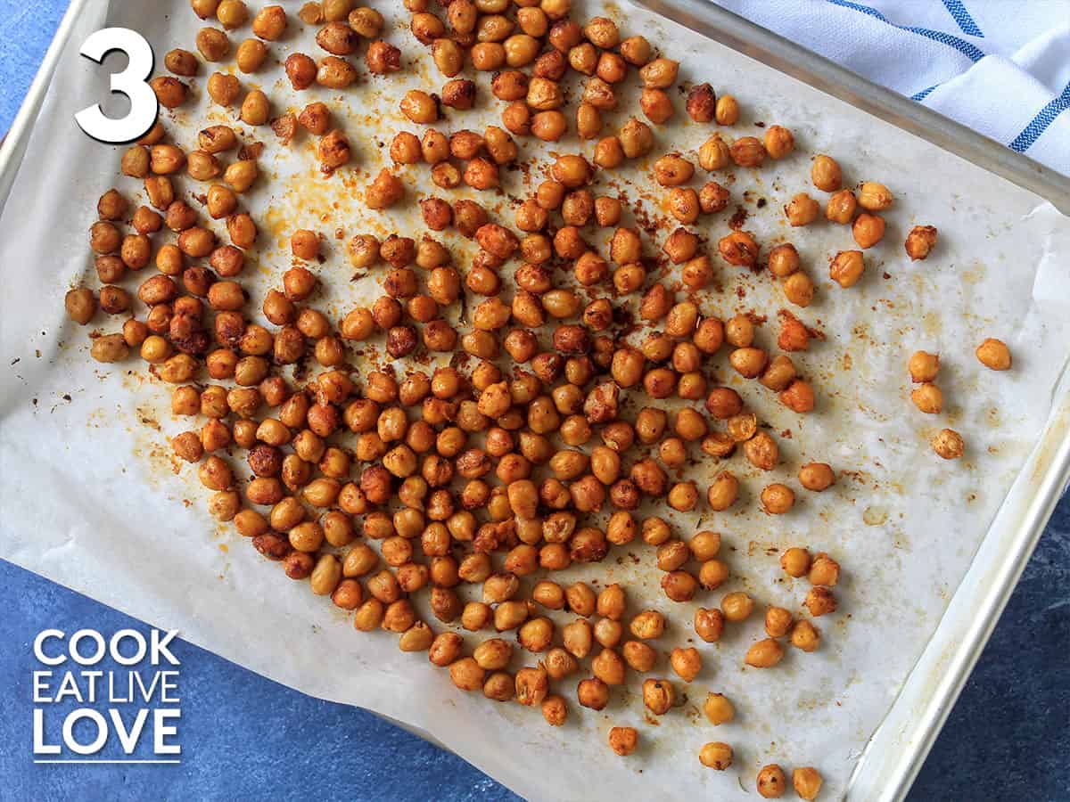 Cooked blackened chickpeas on the baking sheet