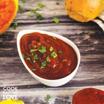 Spicy chipotle bbq sauce in a bowl with fruit