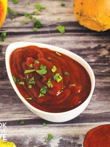 Spicy chipotle bbq sauce in a bowl with fruit