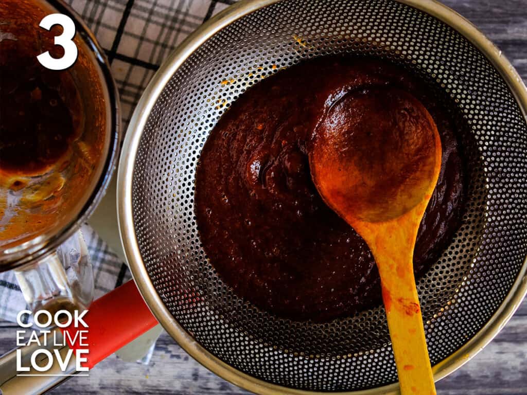 Cooked chipotle bbq sauce in strainer