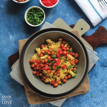 Cajun pasta in a gray bowl with fork