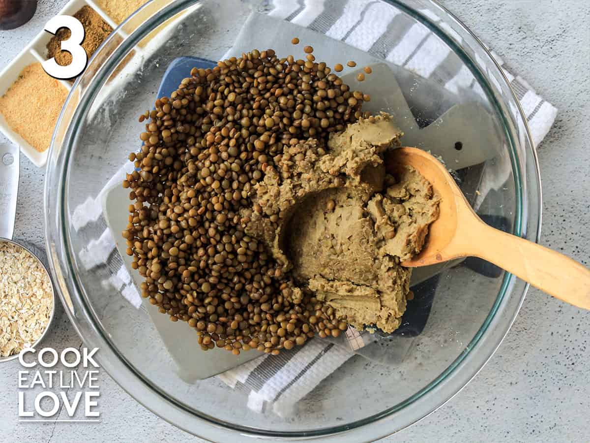 Blended lentils is added to bowl of whole lentils