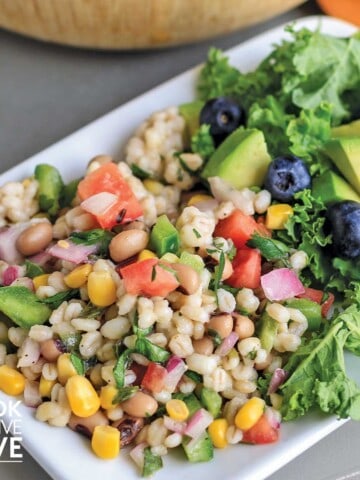 Barley salad with black eyed peas on a white plate
