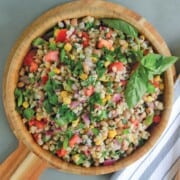 Wooden bowl filled with barley salad