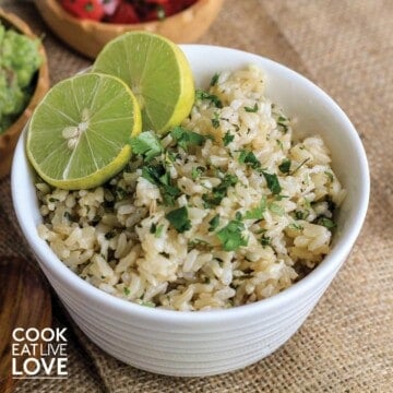Cilantro lime brown rice in a bowl with limes