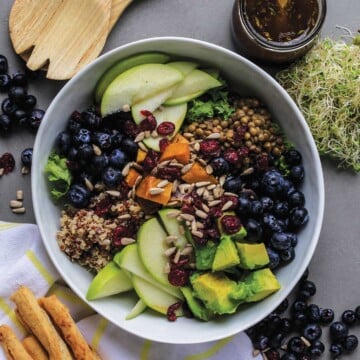 Nourish bowl on table with crackers and breadsticks