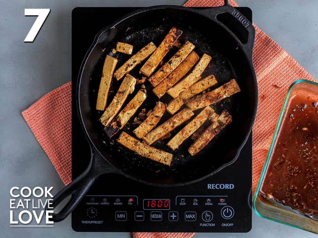 Tofu cooking in a skillet