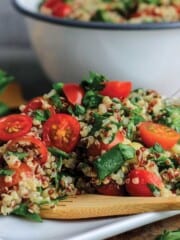 Zesty quinoa salad on a white plate