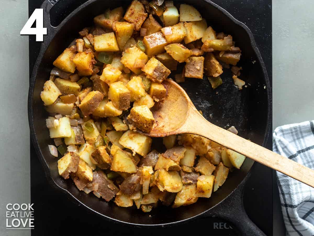 Potatoes cooking in a skillet