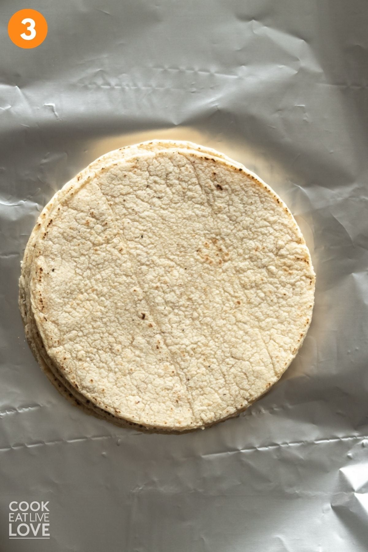 Tortillas on a sheet of foil. 