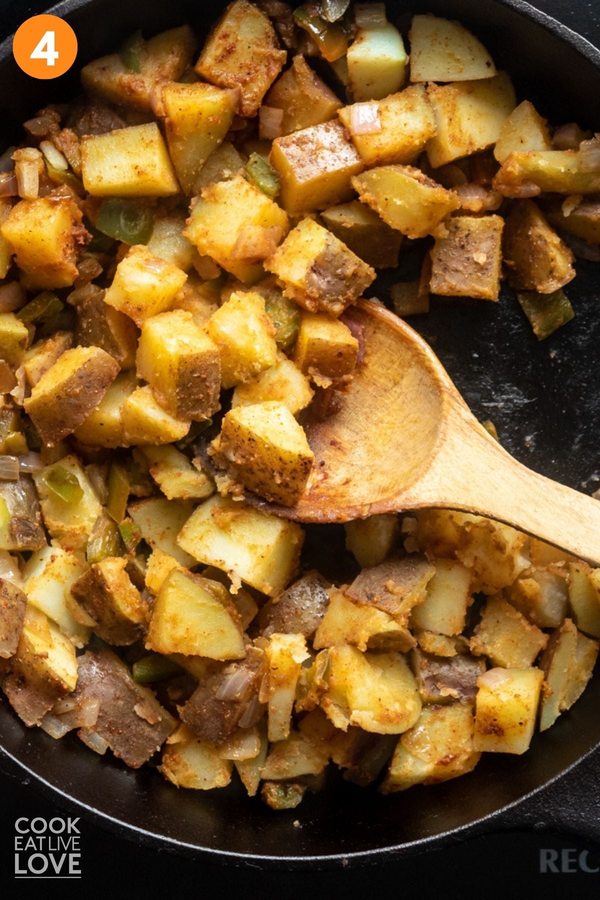 Potatoes for tacos cooking in a skillet. 