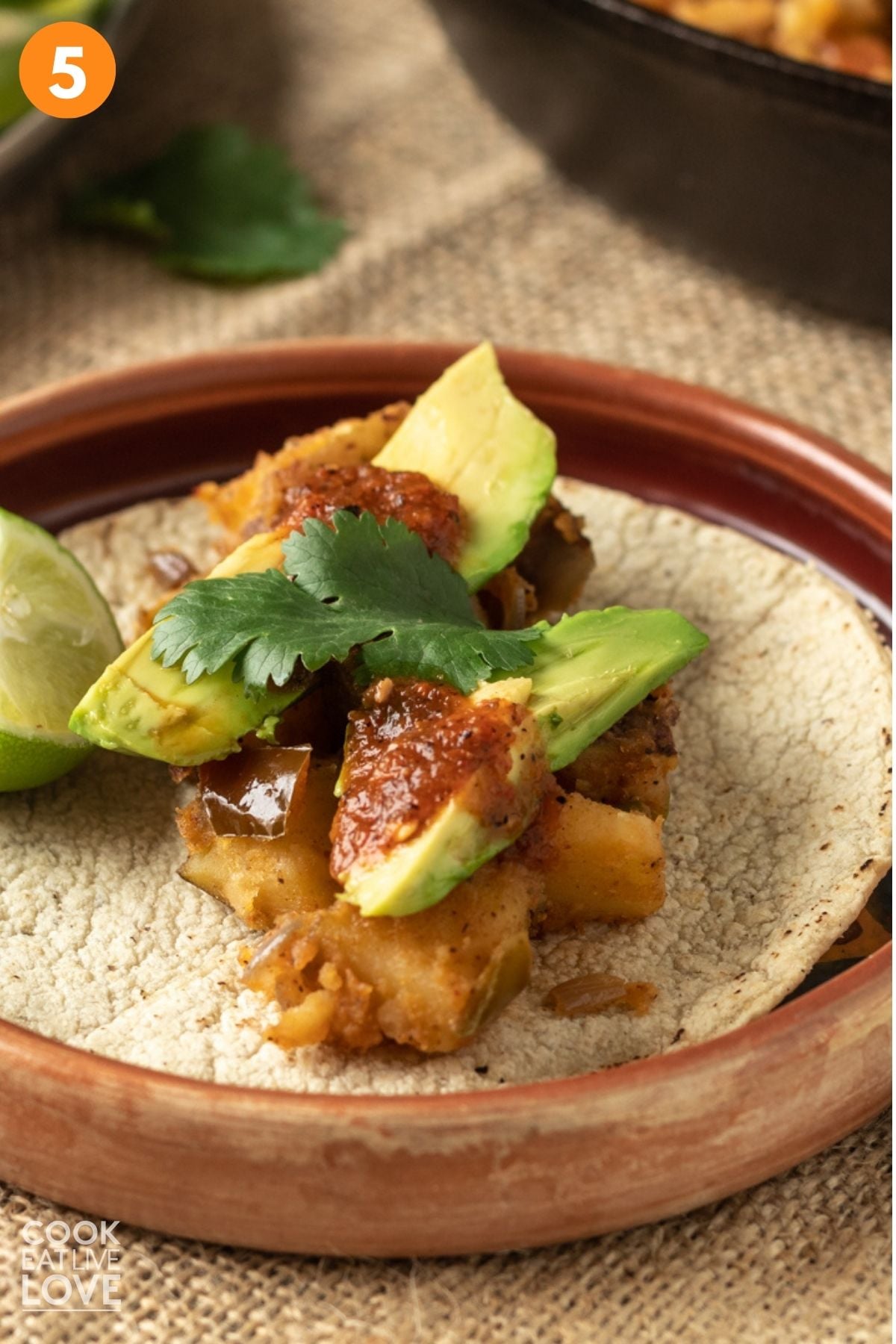 Potato taco assembled on a plate. 
