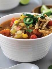 Bowl of vegan taco soup with jalapeno garnish