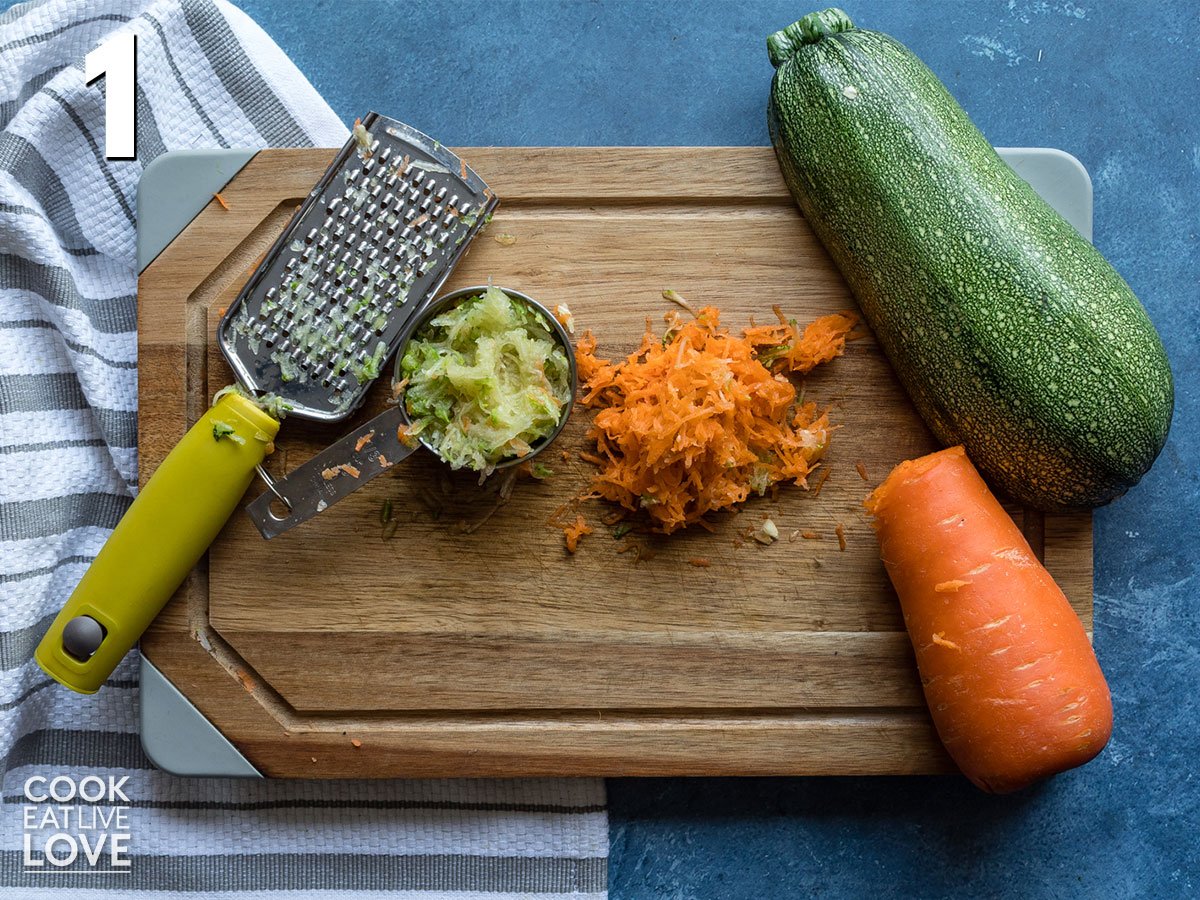 Grated carrots and zucchini on a cutting board
