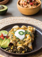 Vegetarian lentil enchiladas are served on a plate