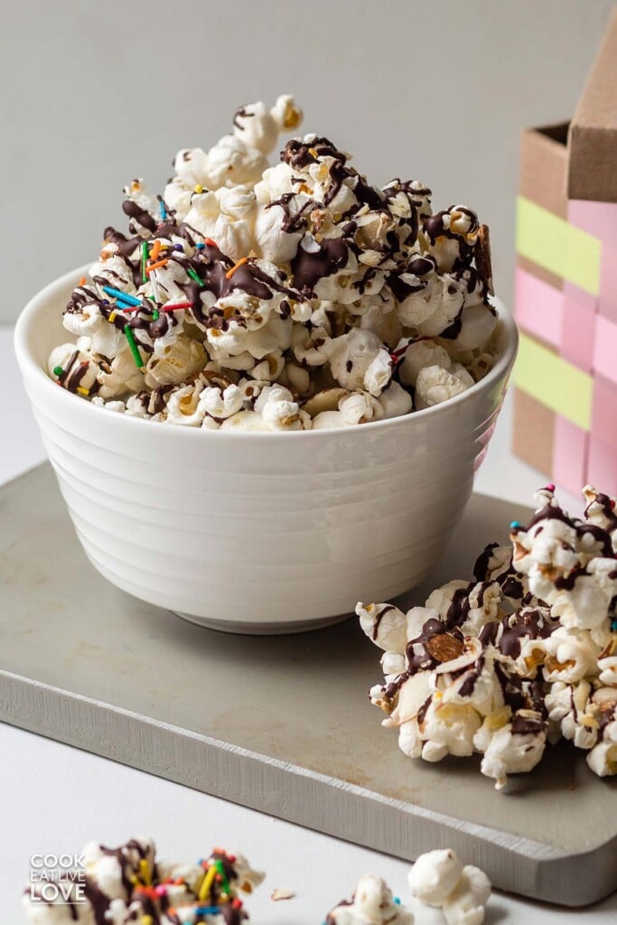 Serving up chocolate drizzled popcorn on the table