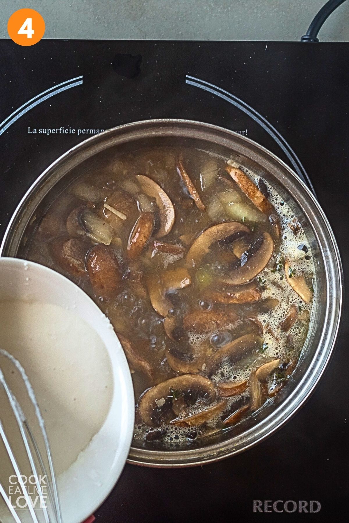 Adding the coconut milk and cornstarch slurry to the pot. 