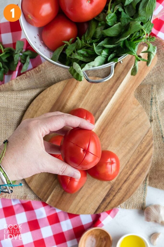 X made on the bottom of a tomato.