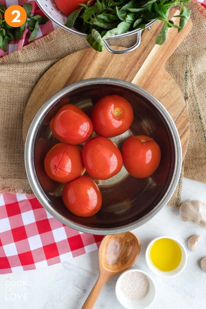 Tomatoes in a hot water bath. 