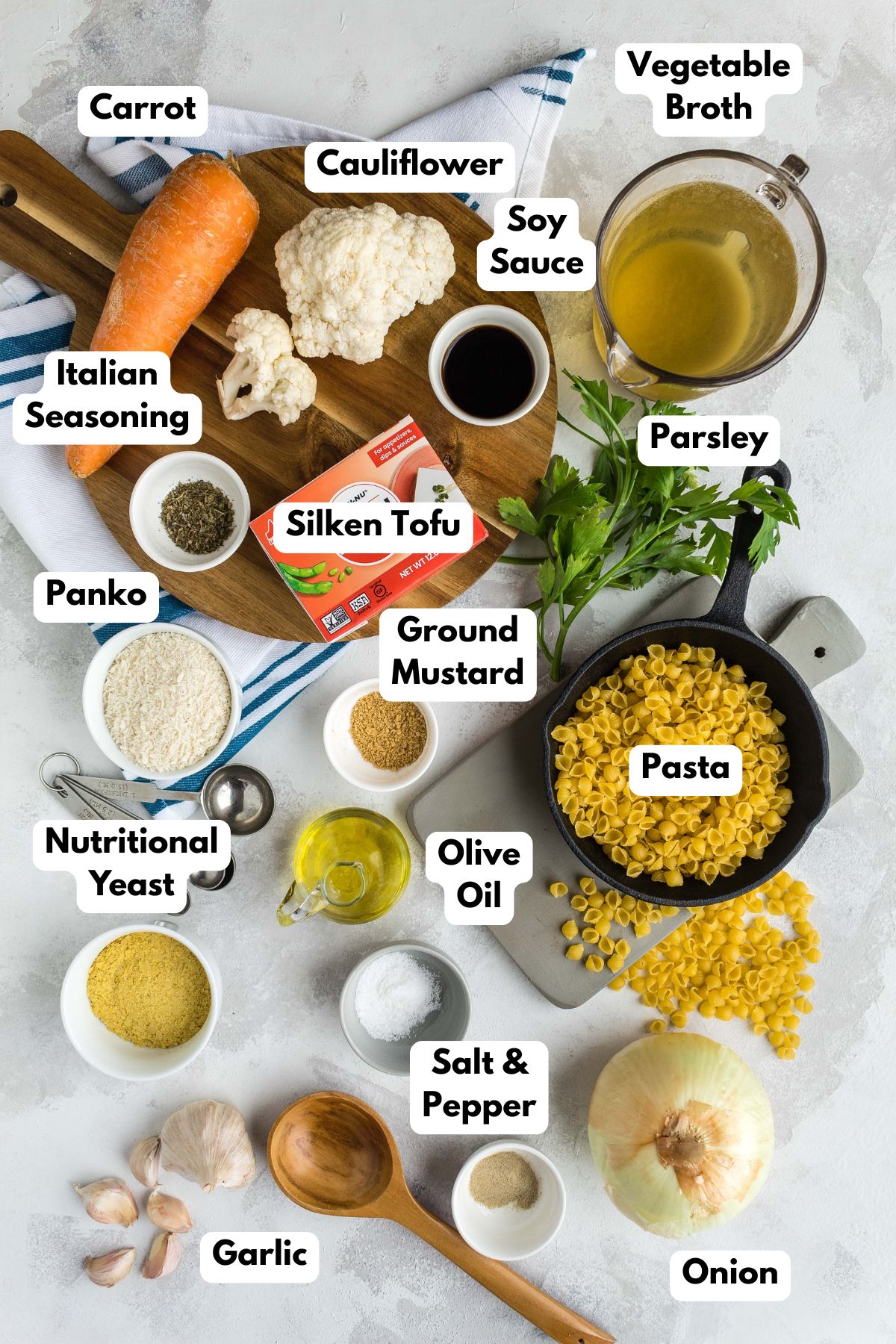 Ingredients to make vegan mac and cheese with text labels to the side.