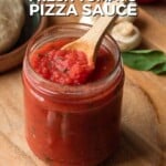 Pin for pinterest graphic with image of pizza sauce fresh tomatoes in a jar with a spoon and text on top.
