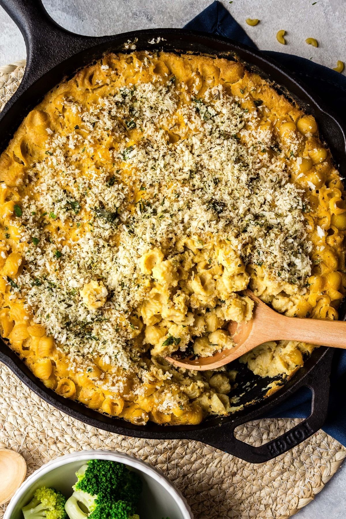 A spoon scooping up a serving of vegan baked mac and cheese.