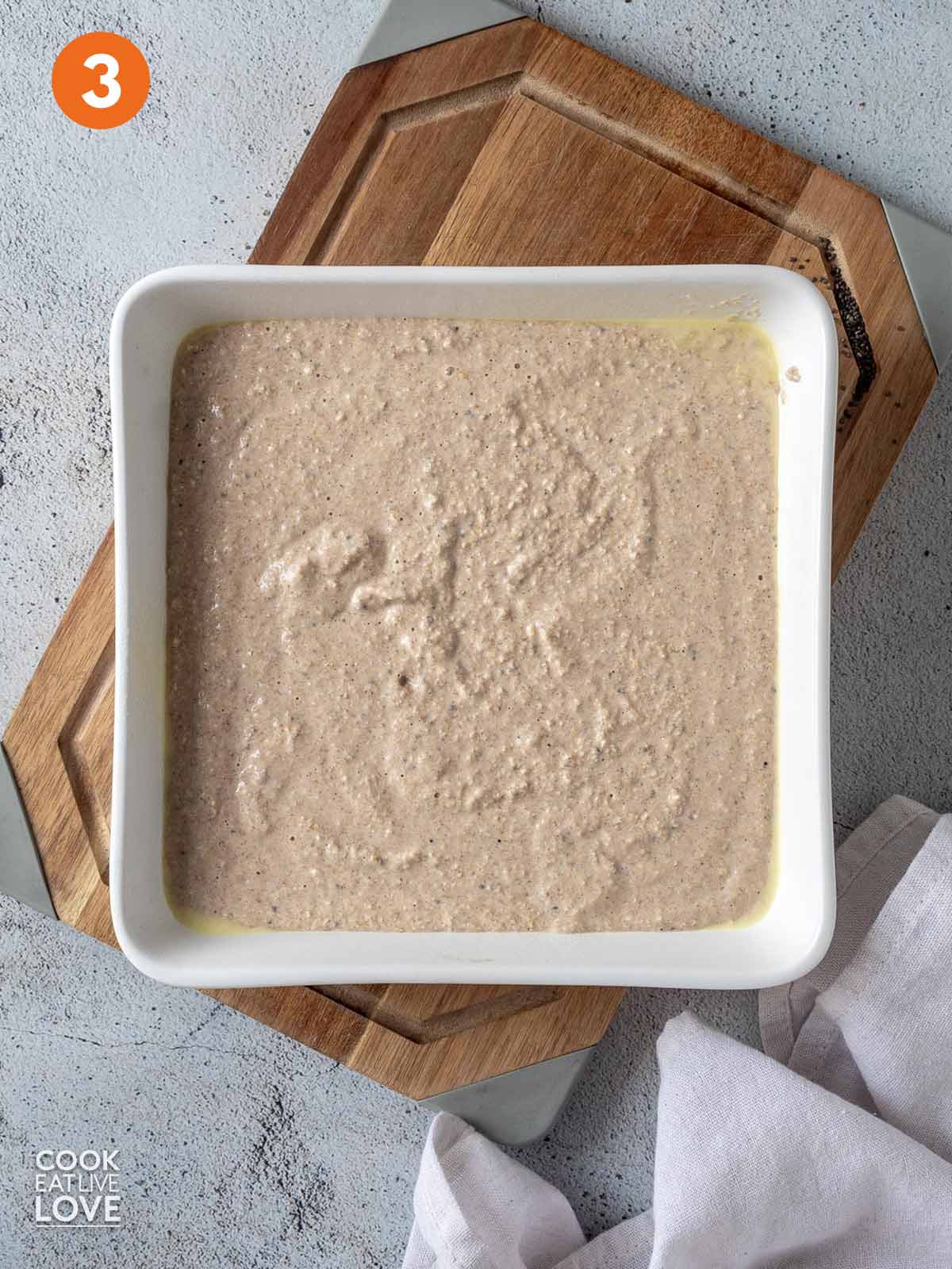 Blended baked oatmeal mixture poured into a baking dish.