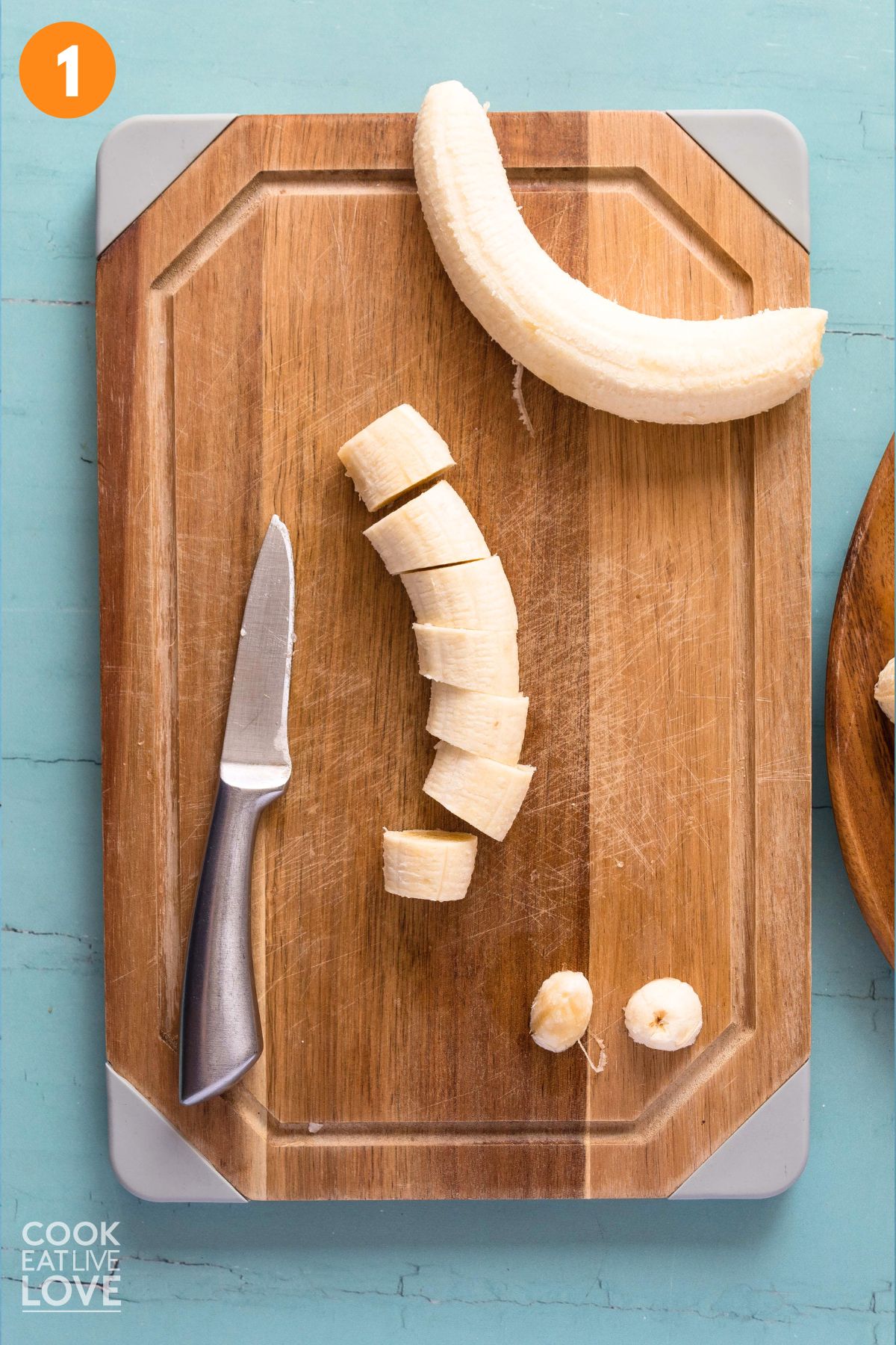 Banana sliced on a cutting board.