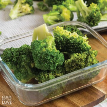 Blanched broccoli in a small container.