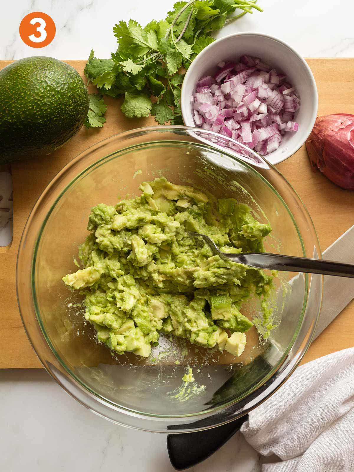 Avocado to make 4-ingredient guacamole in a bowl.