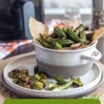Pin for pinterest graphic with image of air fryer okra and text on top.