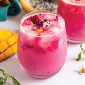 Copycat dragon drink in glass with fresh dragon fruit.