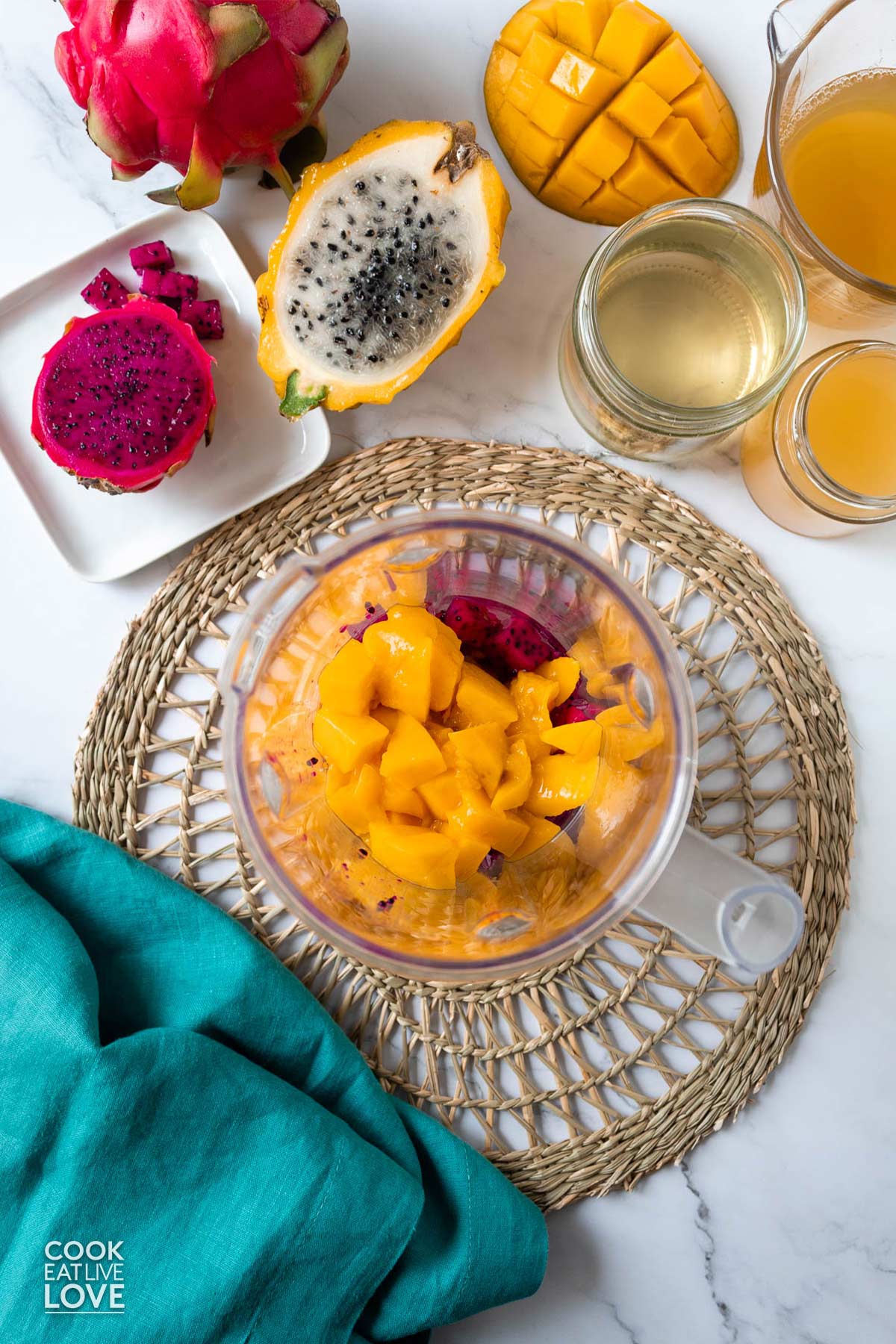 Ingredients to make dragon fruit mango drink on the table.