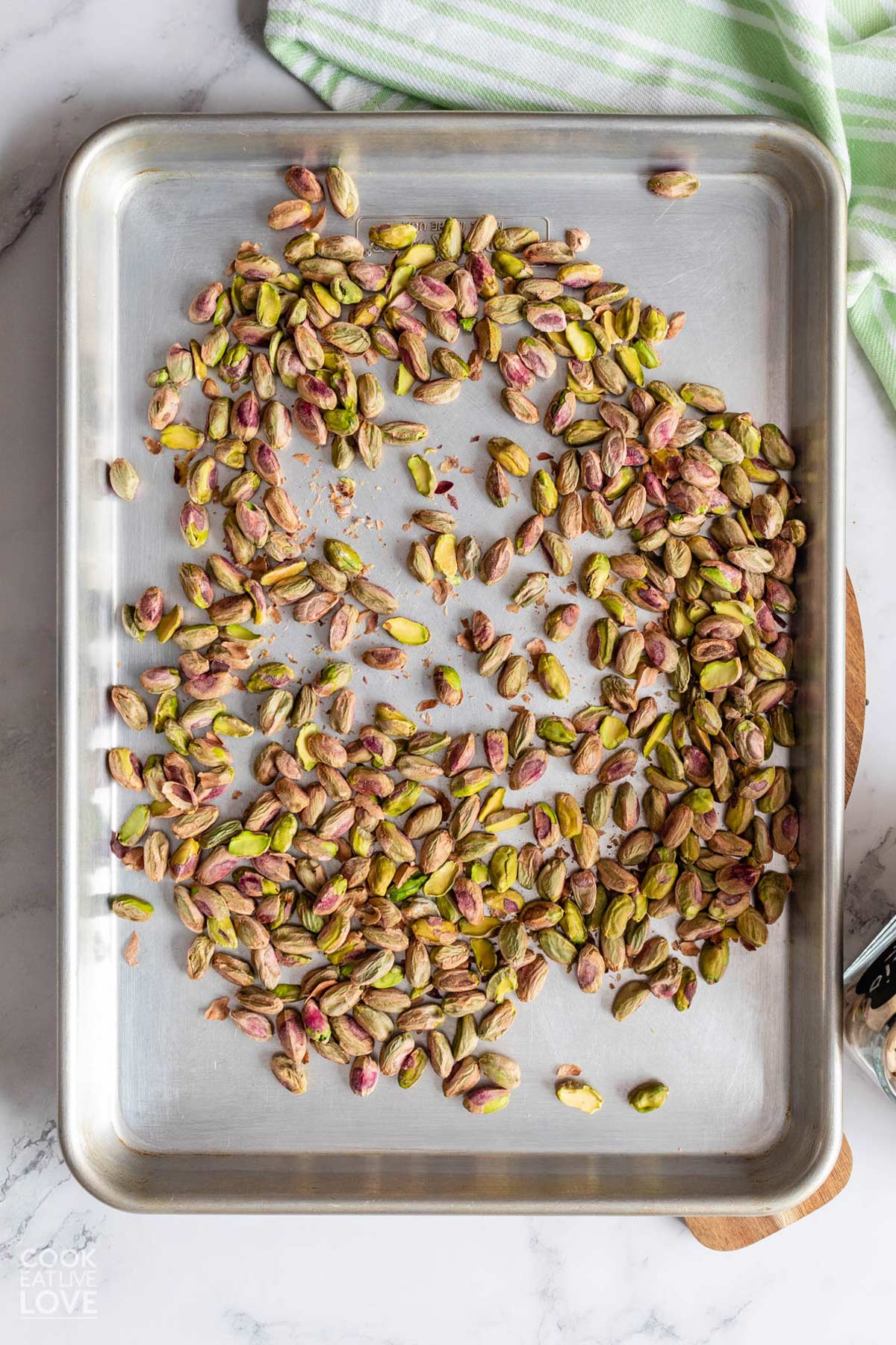 Pistachios on a baking tray.