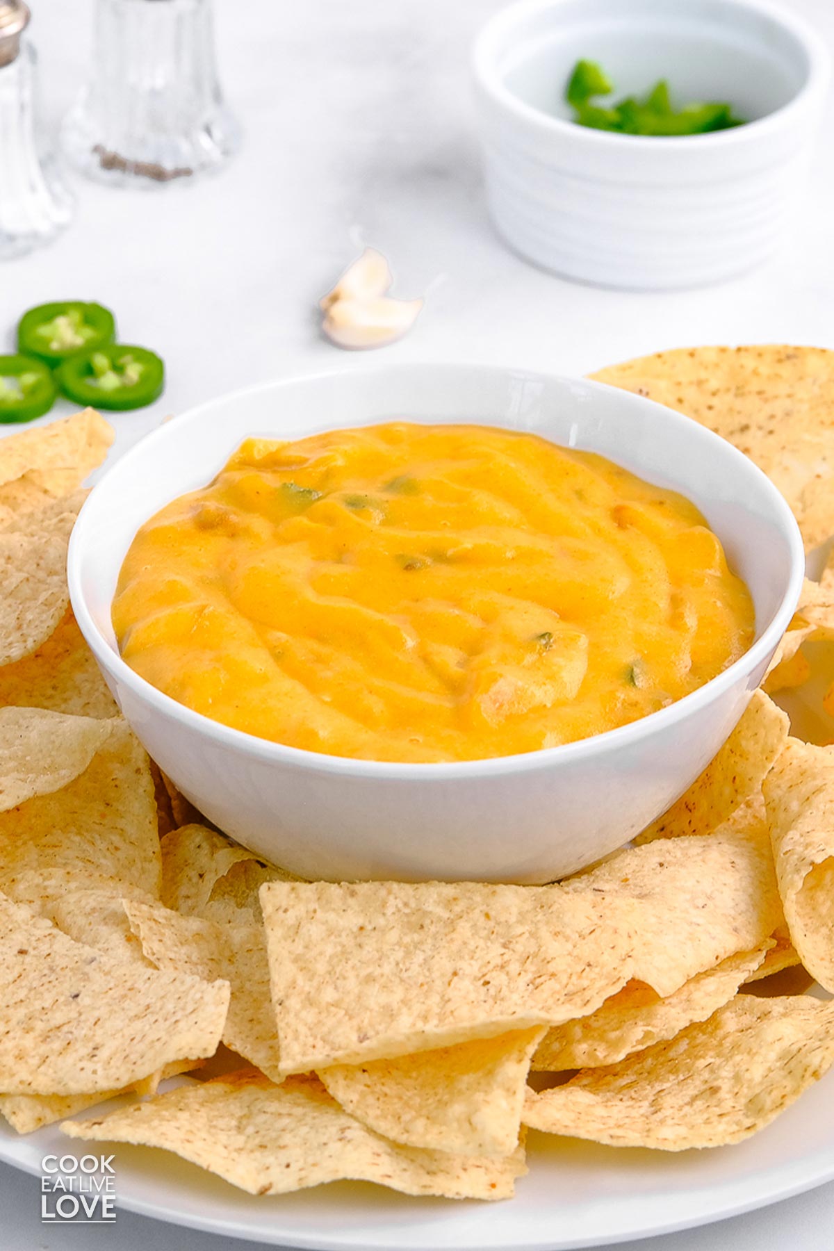 Vegan cheese sauce in a bowl with tortilla chips.