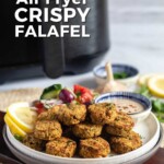 Pin for pinterest graphic with image of air fryer falafel cooked and served on a plate.