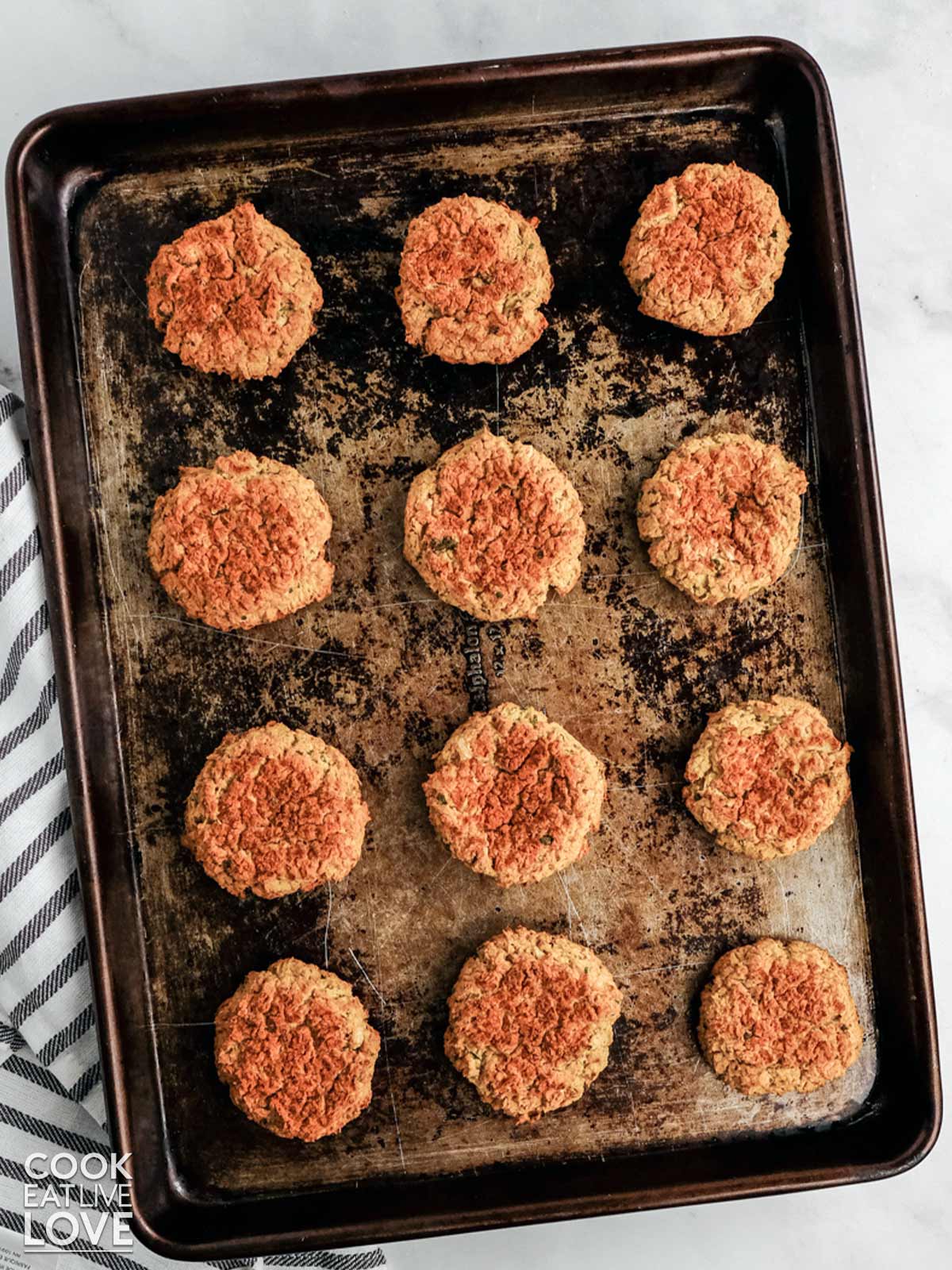 Fresh from the oven, falafel is still on the baking tray.