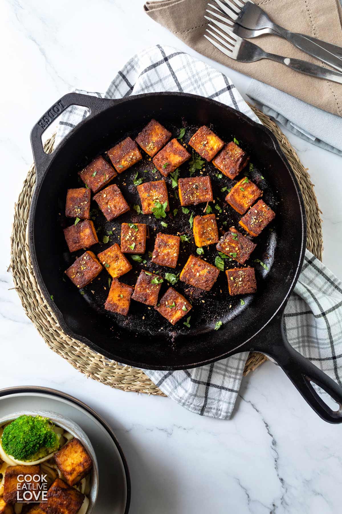 Cooked smoked tofu in a cast iron skillet.