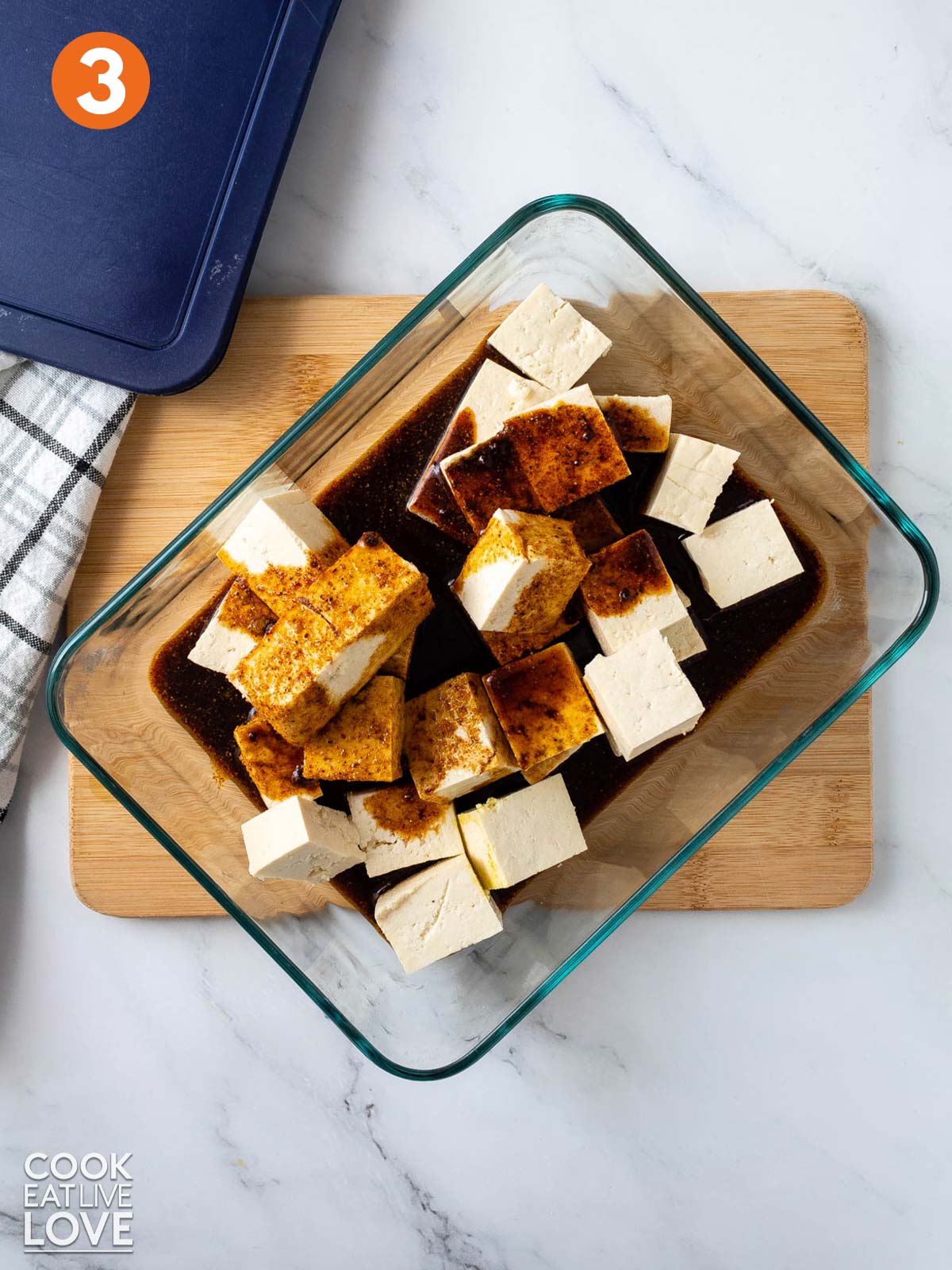 Marinade poured over cubes of tofu.
