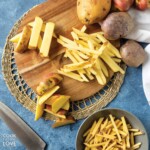 Different cuts of potatoes for french fries on the table.