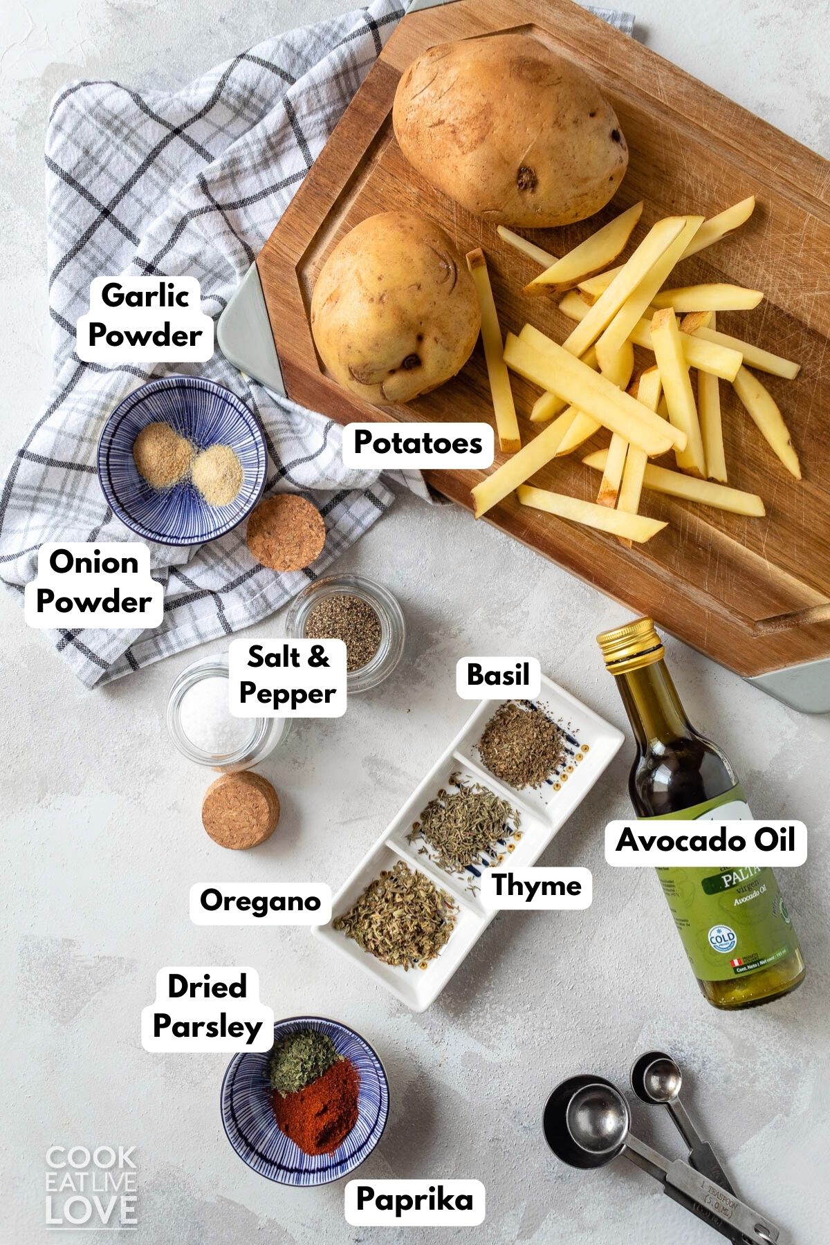 Ingredients to make oven baked french fries on the table.